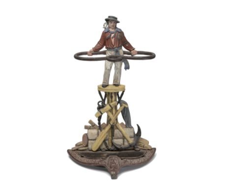 A late 19th century and later polychrome decorated cast iron umbrella stand in the form of Jack Tarthe sailor wearing a broad