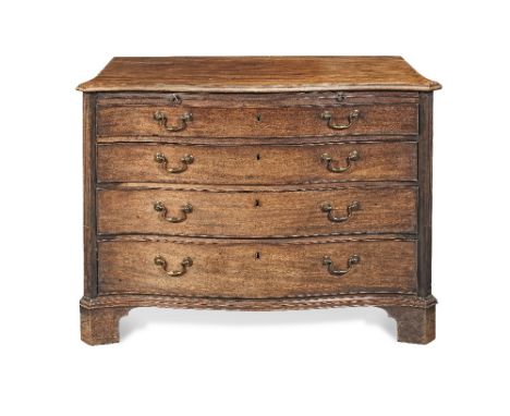 A George III mahogany serpentine commodeCirca 1775, the shaped top with an ogee moulded top above a brushing slide, over four