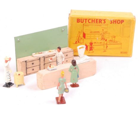Crescent No.1230 Butchers Shop, tin and wooden back drop, wooden block counter, 6 joints of meat, 2 female customers, butcher