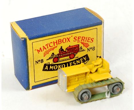 Matchbox 1-75 Series No.8a Caterpillar Tractor, yellow body with silver trim, black hat, green un-perished tracks, in the ori