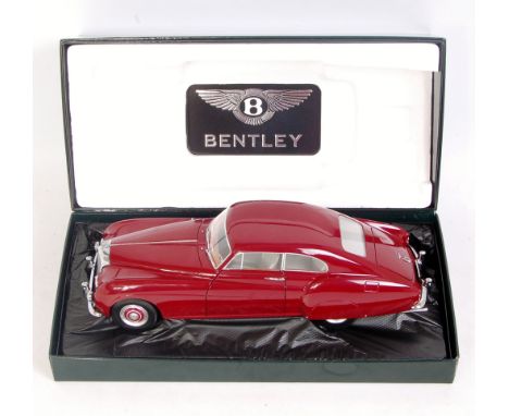 Minichamps 1/18th scale model of a 1954 Bentley R-Type Continental, finished in red, in the original Bentley Branded all card