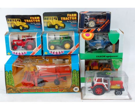 Seven various boxed or plastic cased tractor diecasts or farming implements, manufacturers to include Best Toy Speed Drive, Y