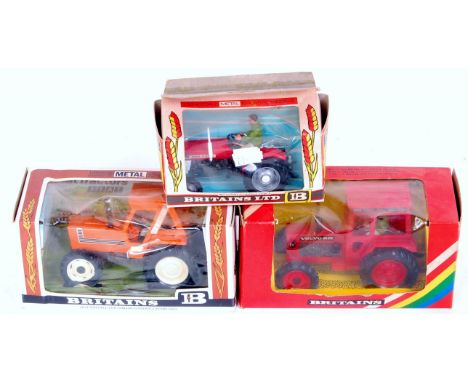 Three various boxed Britains tractors and farm implements, to include; No.9520 Massey Ferguson 135 tractor, No.9521 Volvo BM 