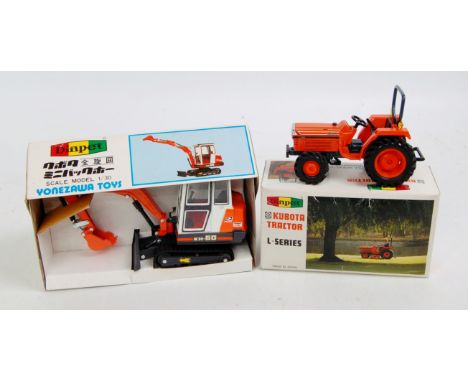 A Yonezawa Diapet 1:25 scale construction diecast group, two examples, both boxes issued to include a KH60 Kubota tractor exc