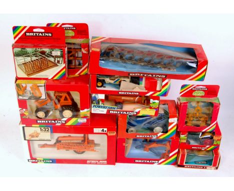 12 various boxed Britains 1/32nd scale Tractors and Farm Implements, all in rainbow window boxes, to include No.9523 Ford Tra