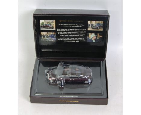 Minichamps 1/43rd scale boxed model of a Bentley State Limousine, finished in metallic maroon, in the original Bentley brande