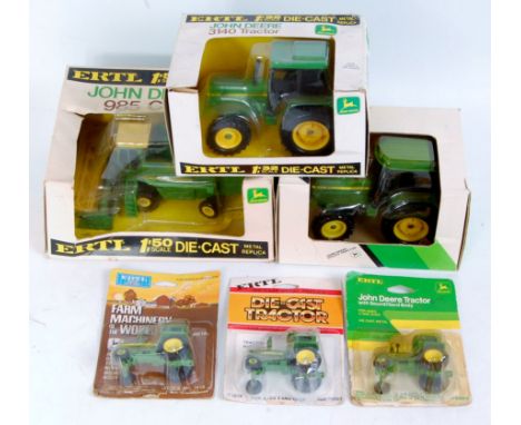 Six various boxed and carded ERTL mixed scale John Deere diecast tractors and farming accessories, to include; 1/32nd scale 3