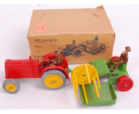 A boxed Charbens farm series farm reaper comprising of red diecast tractor with yellow hubs, and green red and yellow farm re