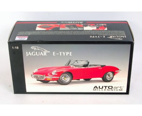 Auto Art Millenium 1/18th scale diecast model of a Jaguar E-Type, finished in red, in the original polystyrene packed box, ap