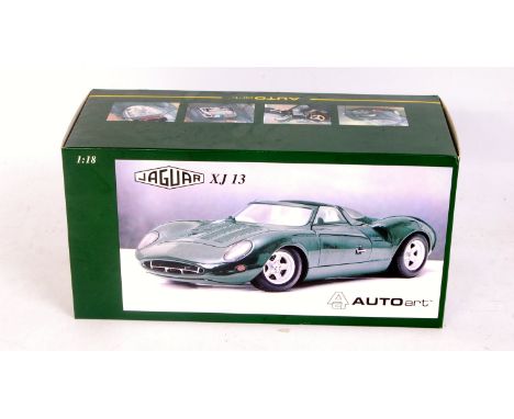 Auto Art 1/18th scale model of a Jaguar XJ 13, finished in dark metallic green, in the original polystyrene packed box (NMM-B