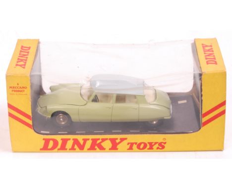 French Dinky Toys, 530, Citroen DS19, light green body, grey roof, cream interior, spun hubs, in the original 360 degree view