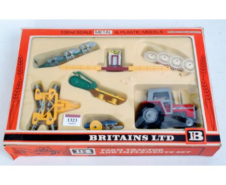 A Britains No. 9592 Massey Ferguson tractor and a farm implements set, appears as issued in the original orange, white and bl