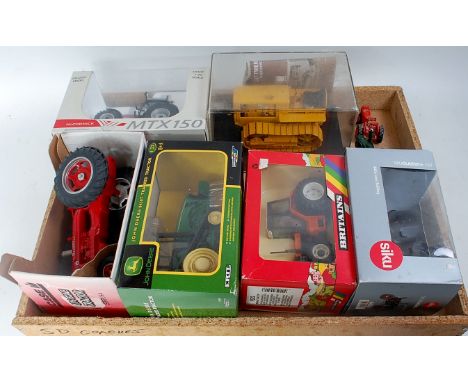 Collection of boxed and part boxed Tractor diecasts and white metal farming vehicles, to include ERTL Farmall McCormick, Brit