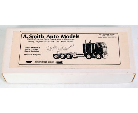 A Smith Auto Models, White Metal Kit for a Kenworth K100 Extended Cab with Roof Spoiler 6x4 Tractor Unit, 1/48th scale, in th