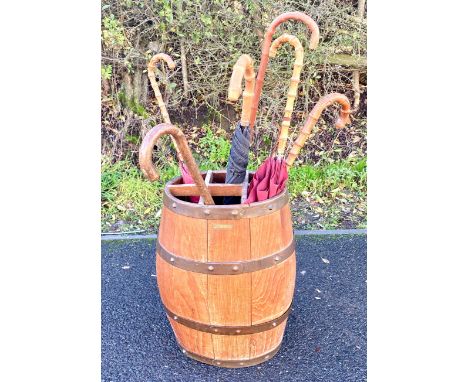 Vintage wooden barrel stick stand with umbrellas and walking stick, approximate height of barrel 21 inches 