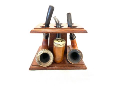 3 Vintage smoking pipes and stand, one with silver rim 