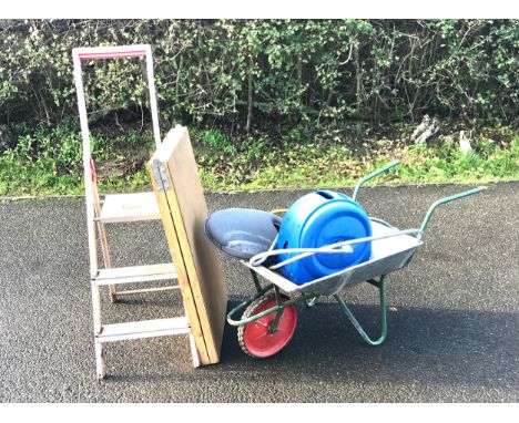 Selection of garden items includes Wheel barrow, step ladder, paste table, reel hose, kneeling mat 