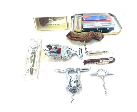 Selection of assorted vintage bottle openers and Parker pens 