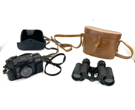 Vintage Carl Zeiss Jena Deltrinem 8 x 30 binoculars in leather case and a vintage Yashica camera in case 