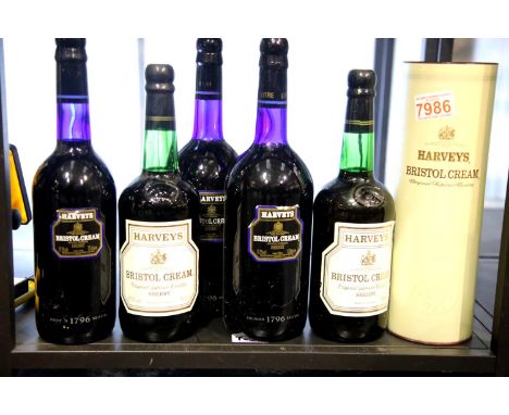 Four bottles and two litres of Harvey's Bristol Cream Sherry. P&amp;P Group 3 (£25+VAT for the first lot and £5+VAT for subse
