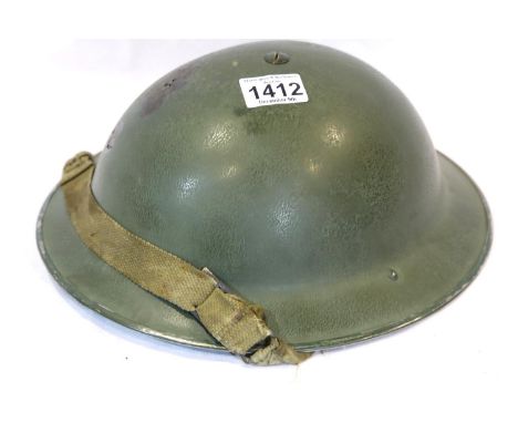 WWII British Tommy Helmet with the insignia of a Gurkha unit. P&amp;P Group 2 (£18+VAT for the first lot and £3+VAT for subse