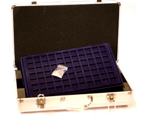 An aluminium coin collectors case with five trays, as new with keys. P&amp;P Group 2 (£18+VAT for the first lot and £3+VAT fo