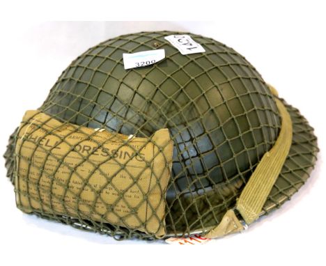 British WWII type Tommy helmet with net and field dressing dated 1941. P&amp;P Group 2 (£18+VAT for the first lot and £3+VAT 