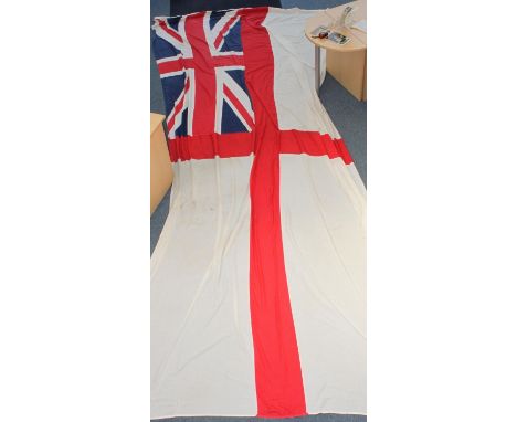 A large naval white ensign, thought to have been from H.M.S Ark Royal, with naval stamps to edge, 270 x 550cm, together with 