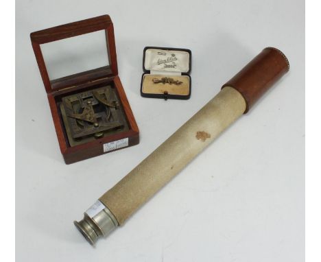 A single draw marine telescope by Voigtlander &amp; Sohn, with canvas wrapped barrel, white metal mounts and tan leather cap 