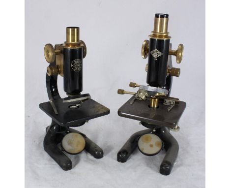 A W.R. Prior &amp; Co of London black enamel and metal microscope with additional slides, in wooden case, together with a C B