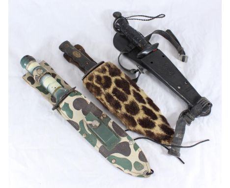 Three assorted knives comprising a possibly Italian example in leopard skin sheath, a Spanish 'Nemrod' and a Taiwanese multi-