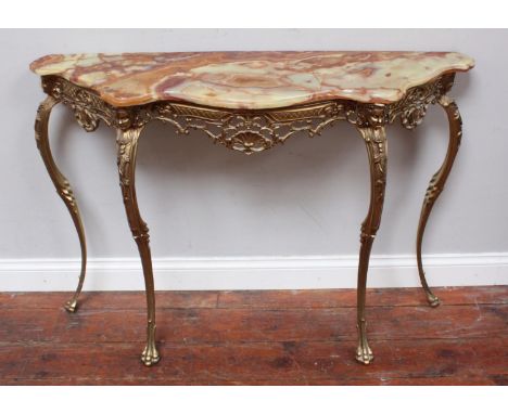 An onyx-topped console table, raised on cast, gilt-metal base, ornately worked with masks and floral decoration, 114cm 