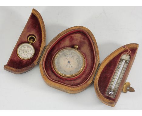 A pocket barometer by J. Hicks of London, together with a small compass and thermometer, all housed in a lined and fitted, pe