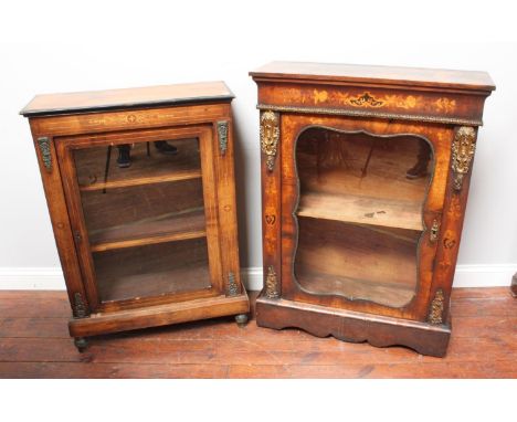 A Victorian burr walnut pier cabinet with floral inlaid decoration and applied brass mounts, the glazed single door enclosing