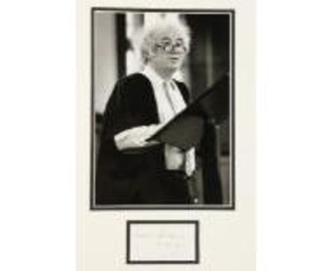 [Heaney (Seamus)]&nbsp;An original black and white Press Photograph of Seamus Heaney standing at a pulpit with robes, mounted