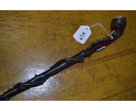 A turned rootwood walking stick, one Briarwood around the central shaft