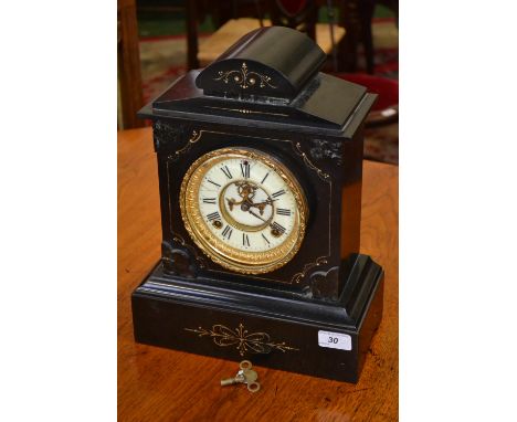 A black slate mantel clock, architectural pediment, enamel chapter ring, Roman numerals, visible escapement, plinth base, cha