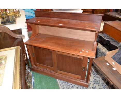 A mahogany chiffonier, galleried shelf, projecting base, sliding door cupboard, plinth base