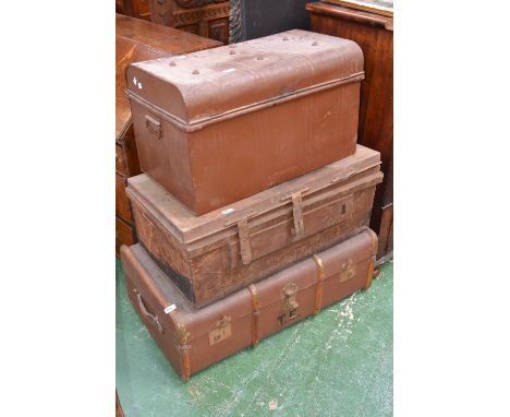 A large travelling trunk 50cm x 91cm x 30cm; another made of tin, 41cm x 69.5cm x 39cm; another 45cm x 83cm x 30cm (3)