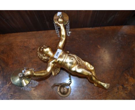 A 20th century gilt plaster suspension lamp, as a flying cherub with arms outstretched, cut glass droplets