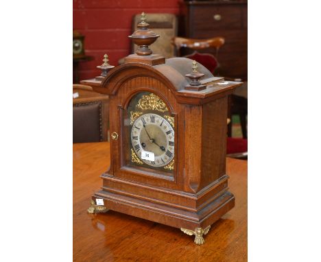 A Victorian dome top mahogany bracket clock, brass dial, silvered numeral ring, eight day striking movement, striking the hou
