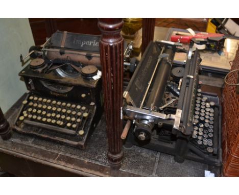 A vintage Imperial typewriter; another, vintage Underwood typewriter (2)