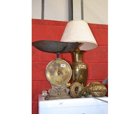 A brass table lamp in vase form; another; a pair of Salters 50T scales (3)