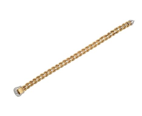A Diamond Buckle Bracelet two rows of yellow rope twist chain terminating to an eight-cut and baguette cut diamond buckle mot
