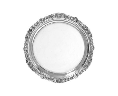 An Edward VII Silver Salver,  by George Howson, London, 1904 shaped circular and on three tapering foliage and shell-cast fee