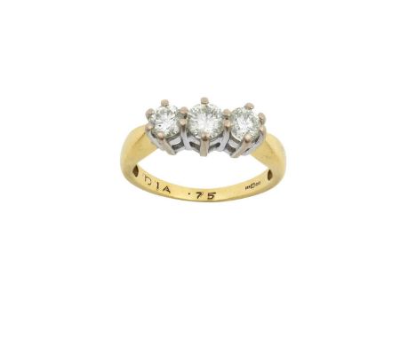 An 18 Carat Gold Diamond Three Stone Ringthe round brilliant cut diamonds in white claw settings, to a yellow tapered shoulde