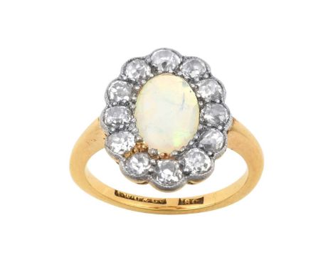 An Opal and Diamond Cluster Ringthe oval opal within a border of old cut diamonds, in white millegrain settings, to a yellow 