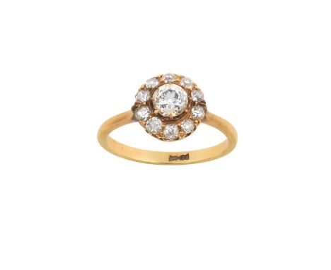A Diamond Cluster Ringthe central raised old cut diamond within a border of smaller old cut diamonds, in yellow claw settings