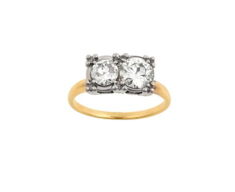 A Diamond Two Stone Ringthe round brilliant cut diamonds in white illusion claw settings, to a yellow tapered shoulder plain 