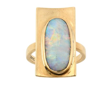 An Opal Ringthe yellow plain polished rectangular plaque overlaid with an oval opal plaque, in a rubbed over setting, to a pl